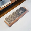 Stando Repose Edge-Stitched Walnut Wrist Rest on a minimalist home office desk