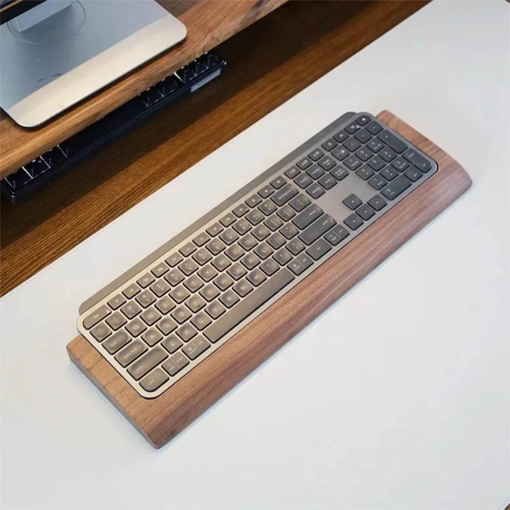 Stando Repose Edge-Stitched Walnut Wrist Rest on a minimalist home office desk